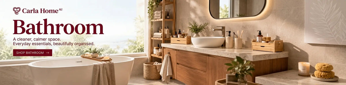 Carla Home Bathroom promotional banner showing a modern bathroom interior with a wooden vanity, white vessel sink, mirror, toiletries, and a bathtub by a window. Large text reads 'Carla Home Bathroom' and 'A cleaner, calmer space.
